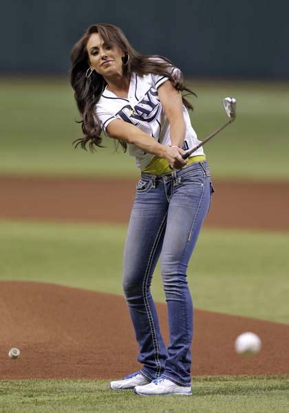 Holly Sonders, co-host of the Golf Channel's "Morning Drive" chips a baseball as the ceremonial ...