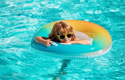 Premium Photo | Child summer vacation summertime kids weekend boy in swiming pool