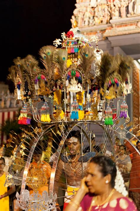 Devotee carrying a kavadi at Thaipusam in Singapore EDITORIAL US by 3523Studio Vectors ...