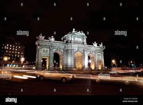 Puerta de Alcala lit up at night Stock Photo - Alamy