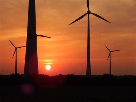 1600x900 wallpaper | silhouette of wind turbine during sunset | Peakpx