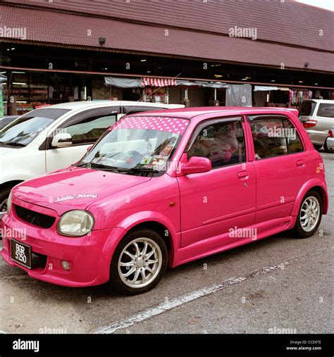 Pink car individuality in Melaka in Malaysia in Far East Southeast Asia ...