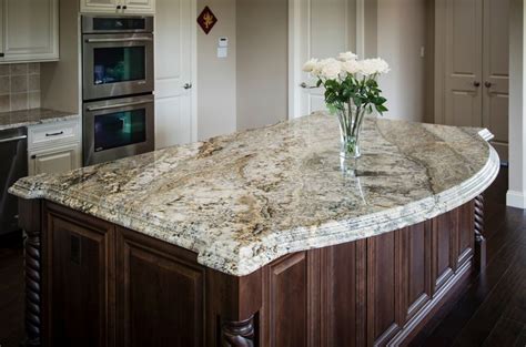 Granite kitchen island with a curved shape overhang and double stacked laminated edg… | Brown ...