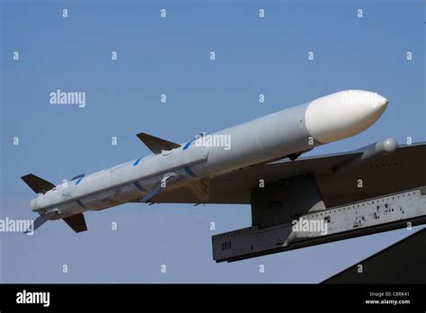 AIM-120 AMRAAM air-to-air missile on the wing of an F-16 fighter jet ...