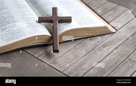 Open bible cross on top hi-res stock photography and images - Alamy