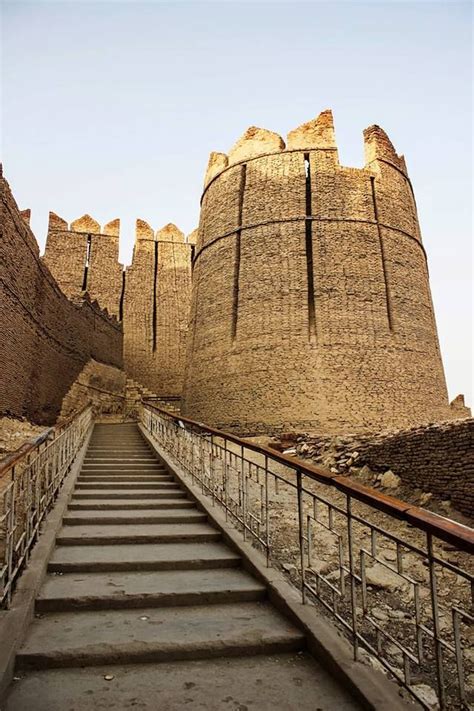 stairs lead up to an old castle like structure