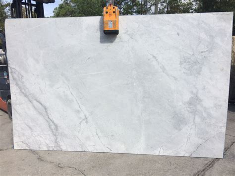 Super White #granite features smooth patterns of gray across a white background. Super White ...