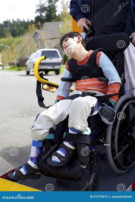 Disabled Boy On School Bus Wheelchair Lift Stock Photography - Image: 31379472