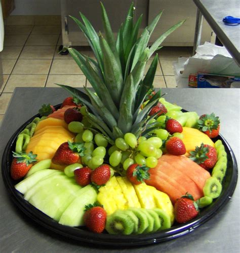 Fruit Tray. Cut off the top of a pineapple for a center piece ...