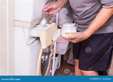 Person Adding Baking Soda into Washing Machine To Wash Clothes Stock Image - Image of product ...