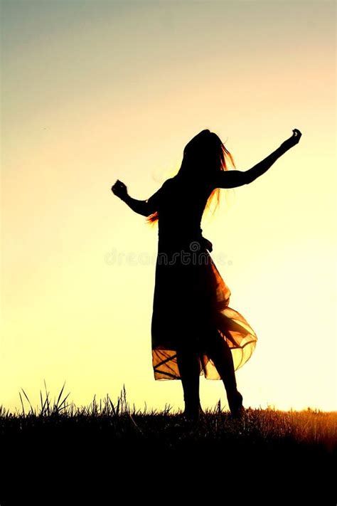 Silhouette of Woman Dancing and Praising God at Sunset Stock Photo ...