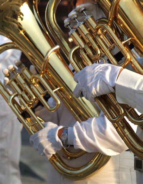 Two Tuba Players stock image. Image of fingers, reflection - 23272483