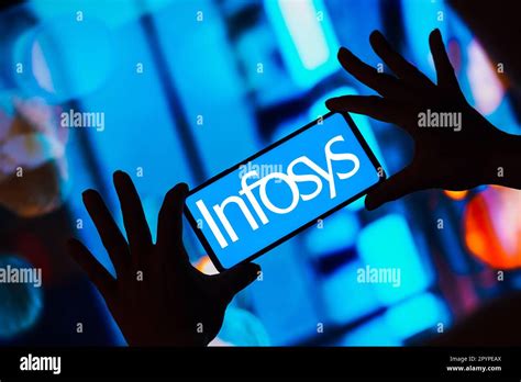 In this photo illustration, the Infosys Limited logo is displayed on a smartphone screen Stock ...