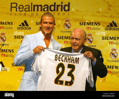 David Beckham (left) holds his new number 23 Real Madrid shirt ...