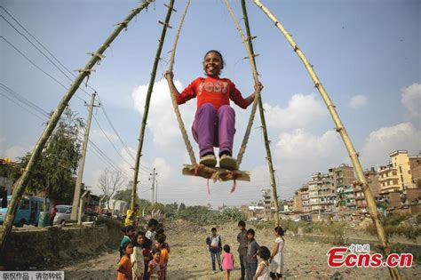 Nepali children having fun with Dashain Ping swing