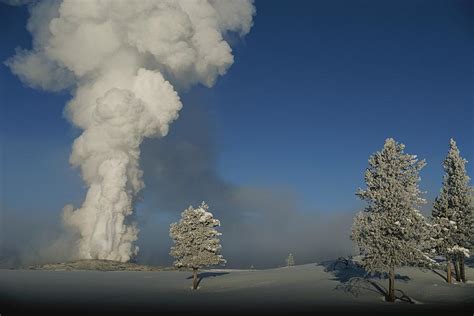 Winter View Of Old Faithful Geyser by Norbert Rosing