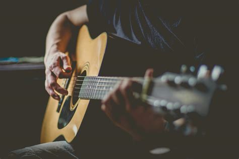 Man Playing An Acoustic Guitar · Free Stock Photo