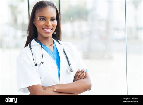 Black female doctor with arms crossed hi-res stock photography and ...