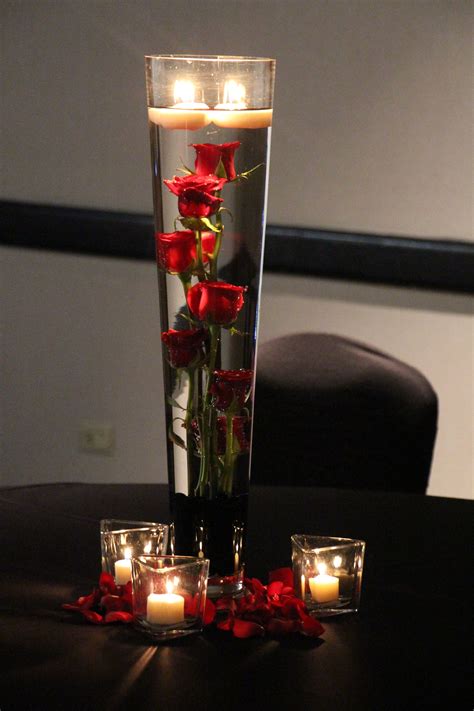 Submerged red roses | Red rose centerpiece wedding, Rose centerpieces ...