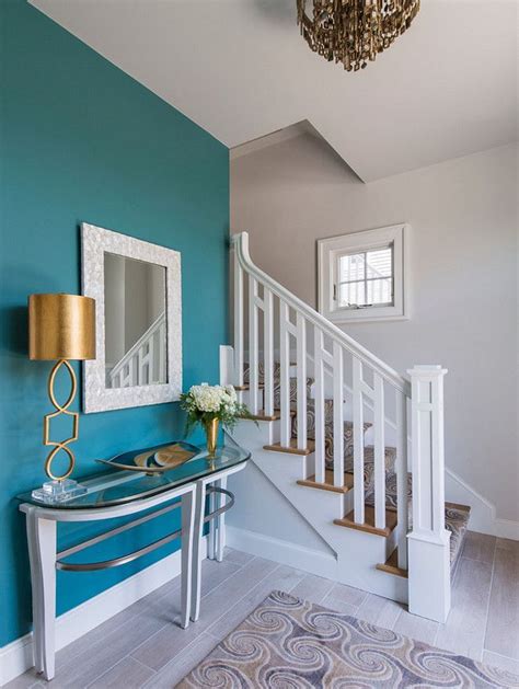 The accent wall paint color is Benjamin Moore Mayo Teal CW 570. The ...