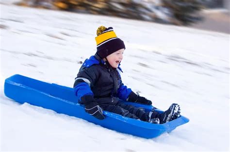 Little Boys First Sled Ride — Stock Photo © PrairieRattler #5255101