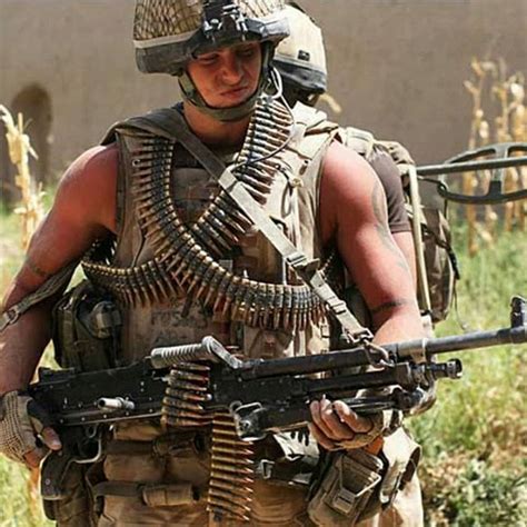 A British Army 2 Para machine gunner with L7A2 medium machine gun on patrol in Afghanistan ...