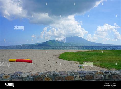 View of the Nevis Peak volcano across the water from St Kitts Stock Photo - Alamy