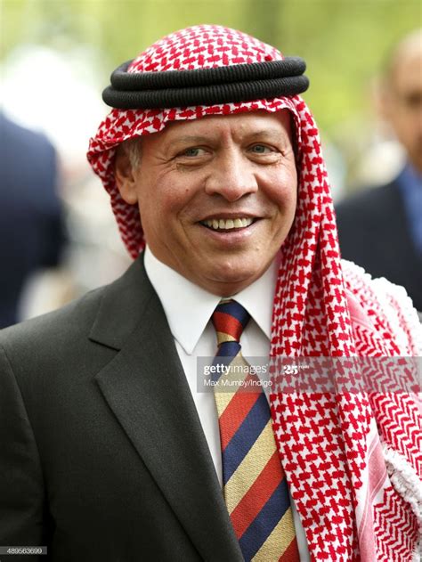 a man wearing a red, white and blue scarf