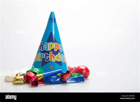 Blue party hat with balloons and party blowers Stock Photo - Alamy