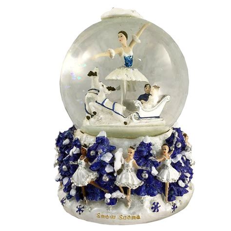 This charming Snow Fantasy snow globe shows Clara and her Nutcracker Prince taking an enchanted ...