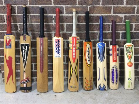 there are many different types of baseball bats lined up in a row ...