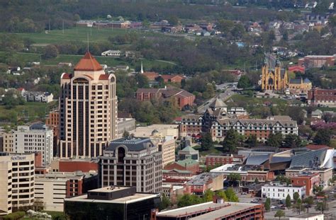 an aerial view of a city with tall buildings