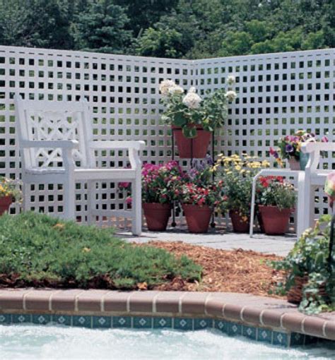 This white lattice square design makes a beautiful privacy fence for ...