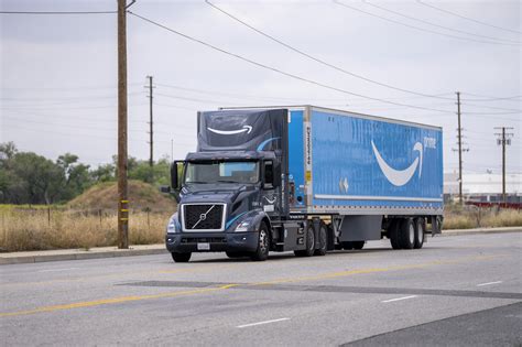 Amazon rolls out fleet of heavy-duty electric trucks to decarbonize more of its transportation ...