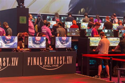 Video game fair visitors at game stations, playing the Battle Royal game Apex Legends - Creative ...