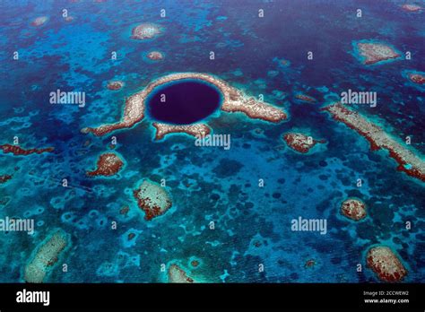 Aerial view of The Great Blue Hole, a UNESCO world natural heritage site, Lighthouse Reef Atoll ...