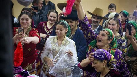 Roma gypsies dance in celebration inside a community hall in ...