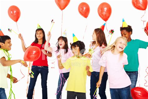 Joyful Multi Ethnic Kids With Balloons Dancing IN Birthday Party Stock ...