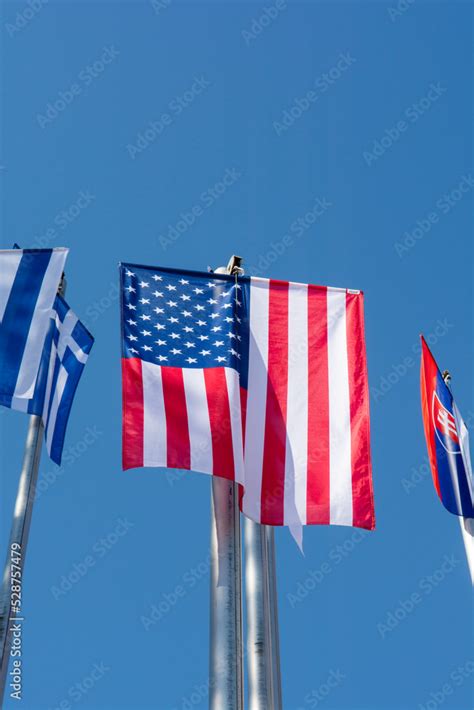 Row of national flags. World Flags Blowing In The Wind. Stock Photo ...