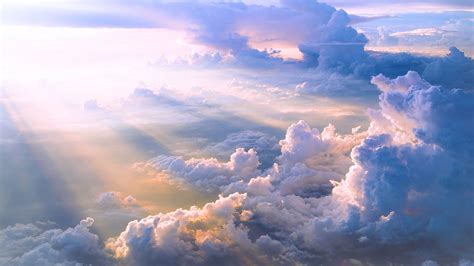 the sky is filled with lots of clouds and sun beams shining down on top ...