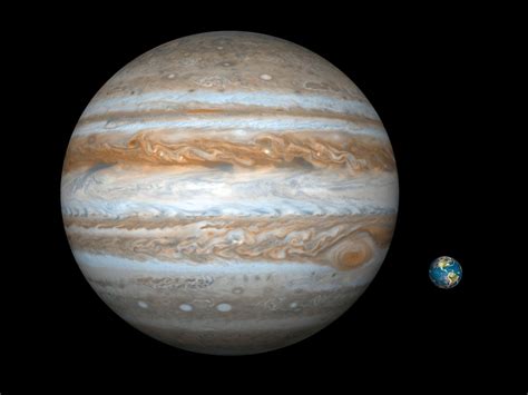 Une illustration comparative de Jupiter (à gauche) et de la Terre (à ...