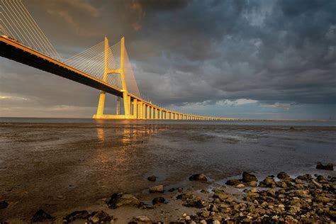 Vasco da Gama Bridge at sunset in Lisbon, Portugal Photograph by Michalakis Ppalis | Pixels