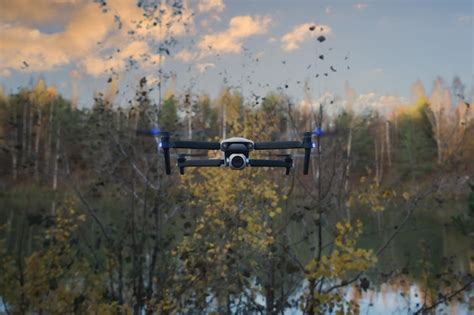 Premium Photo | Drone with a camera in the air in nature near trees