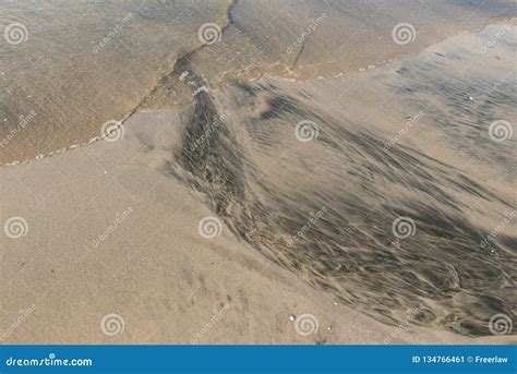 Ripple marks on sand beach stock image. Image of shoreline - 134766461