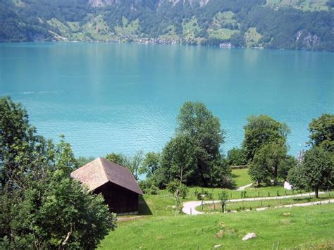 Premium Photo | Turquoise bay under the mountain with hotels and other buildings along the shores