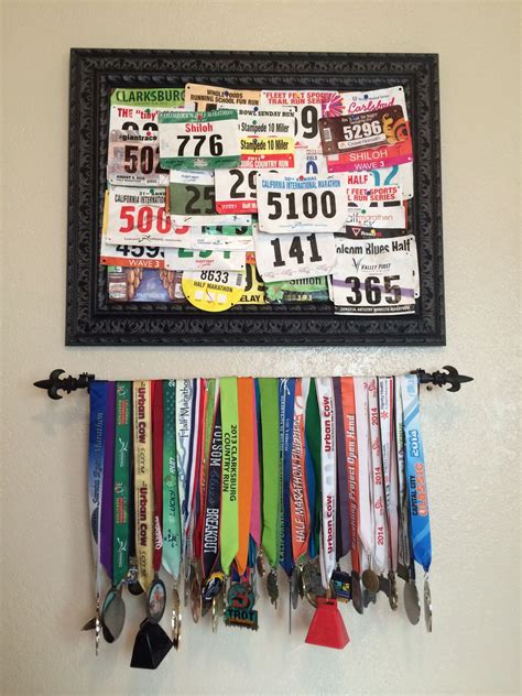 Race bib and medal display. Use a curtain rod for the medals and a framed cork board for the ...