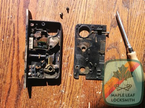 An old norwalk mortise lock with original key, one broken spring.
