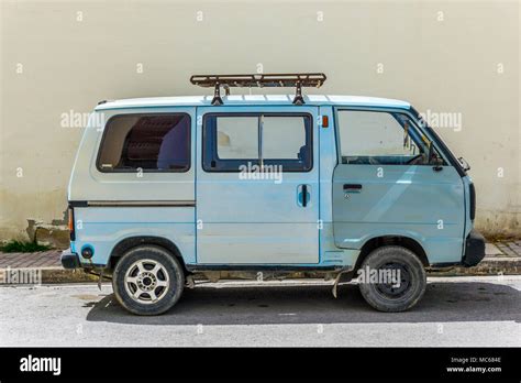 An old blue mini van parked in the street in St Pauls Bay, Malta, Europe Stock Photo - Alamy