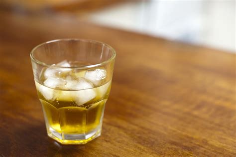 Free Image of Liquor Concept - Glass of Whiskey with Ice | Freebie.Photography