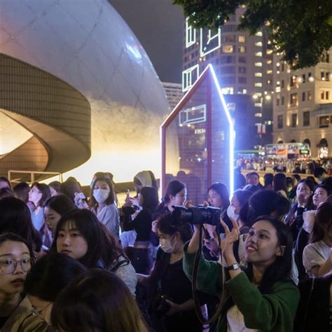 Thousands of celebrity spotters gather outside glitzy Louis Vuitton runway show as Hong Kong ...